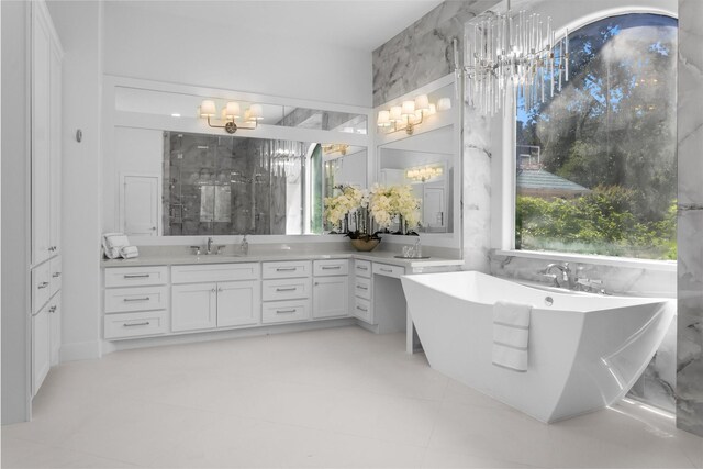 16059 Walden Rd, Conroe, TX 77356 - full bath with a shower, a notable chandelier, vanity, and a freestanding bath
