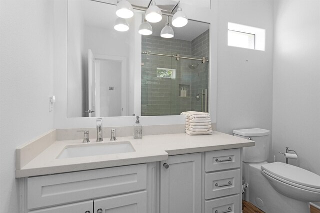 16059 Walden Rd, Conroe, TX 77356 - full bathroom with a stall shower, vanity, and toilet