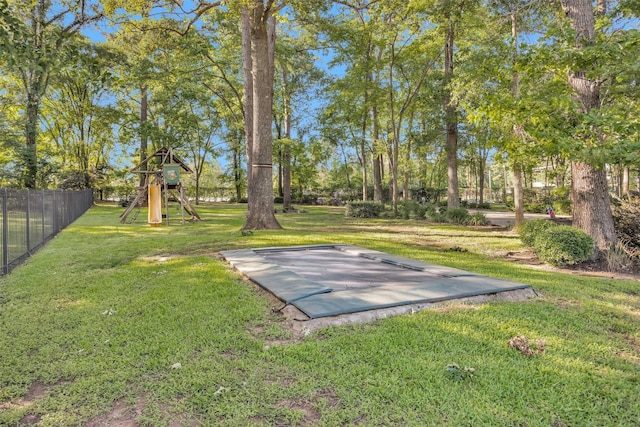 16059 Walden Rd, Conroe, TX 77356 - view of yard with a playground and fence