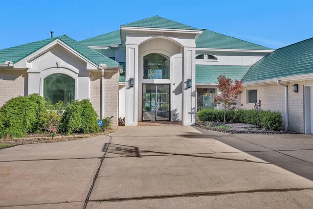 16059 Walden Rd, Conroe, TX 77356 - doorway to property featuring brick siding