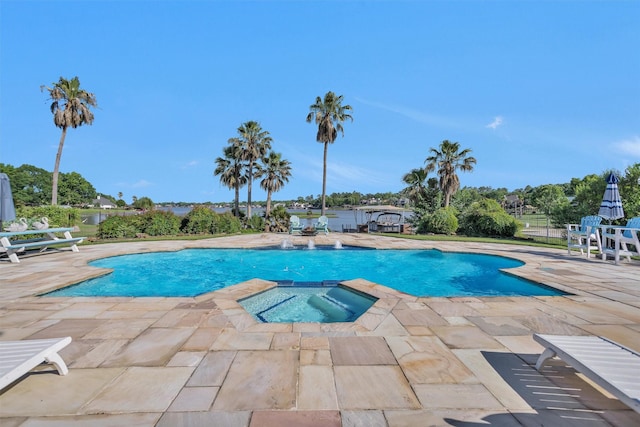 16059 Walden Rd, Conroe, TX 77356 - view of swimming pool featuring a patio and a pool with connected hot tub