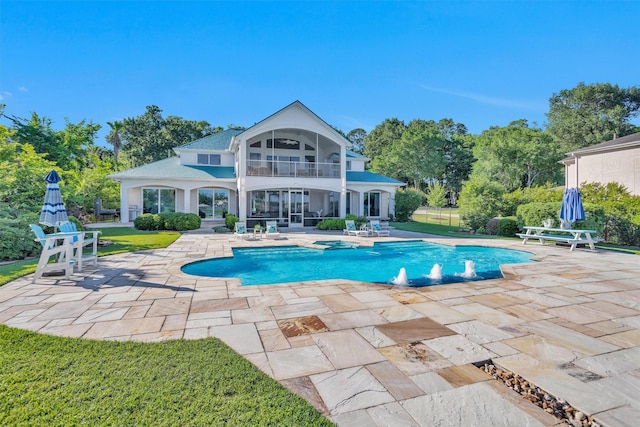 16059 Walden Rd, Conroe, TX 77356 - view of swimming pool with a patio area and a pool with connected hot tub
