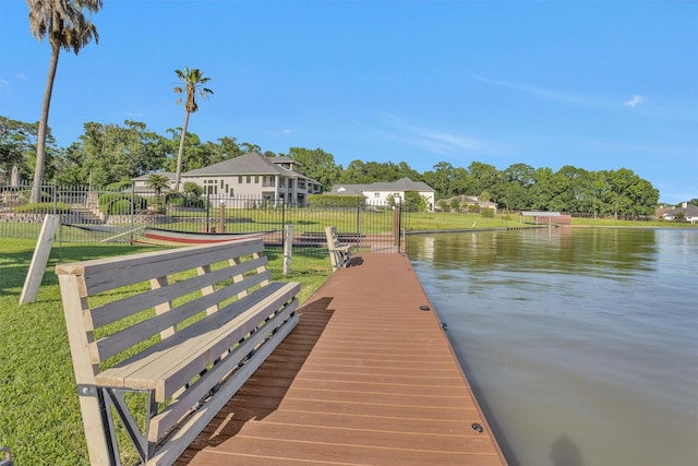 16059 Walden Rd, Conroe, TX 77356 - view of dock with a yard, a water view, and fence