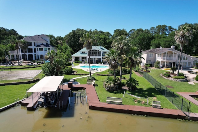16059 Walden Rd, Conroe, TX 77356 - surrounding community featuring a lawn, a dock, fence, and boat lift