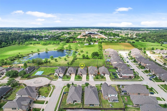 birds eye view of property featuring a residential view and a water view