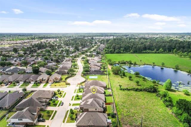 drone / aerial view featuring a water view and a residential view