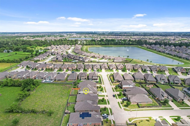 aerial view with a residential view and a water view