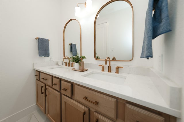 14924 Scarlet Branch Dr, Conroe, TX 77302 - bathroom featuring baseboards, a sink, and double vanity