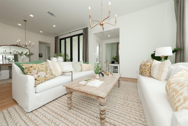 14924 Scarlet Branch Dr, Conroe, TX 77302 - living area with visible vents, wood finished floors, recessed lighting, and a notable chandelier