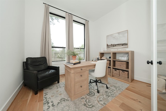 14924 Scarlet Branch Dr, Conroe, TX 77302 - office with baseboards, french doors, and light wood-style floors