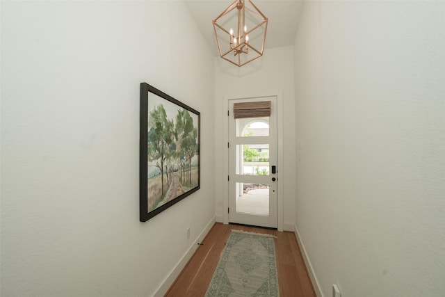 14924 Scarlet Branch Dr, Conroe, TX 77302 - entryway featuring baseboards, wood finished floors, and a chandelier
