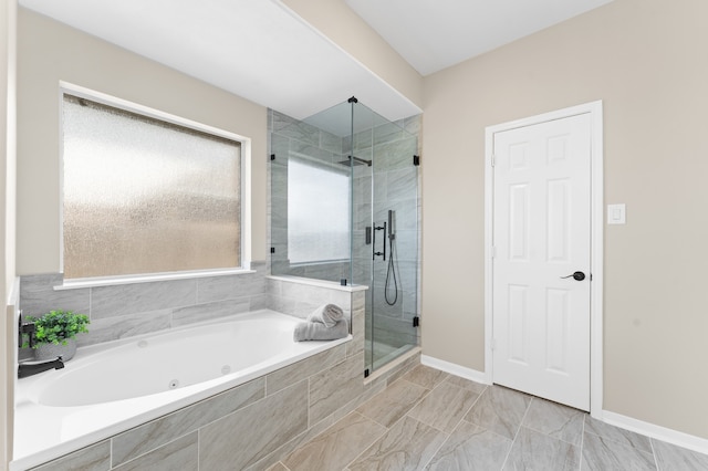 14911 Hurst Point Ln, Houston, TX 77049 - full bathroom featuring a shower stall, a tub with jets, and baseboards