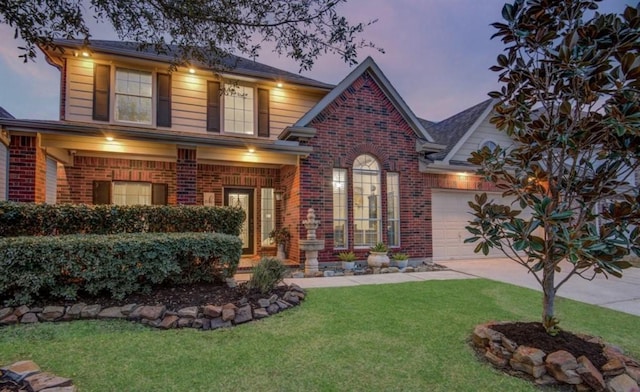 14911 Hurst Point Ln, Houston, TX 77049 - traditional home featuring brick siding, concrete driveway, a yard, and an attached garage