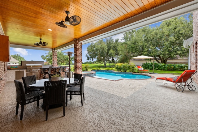 view of patio featuring a grill, a pool with connected hot tub, outdoor dining area, and area for grilling