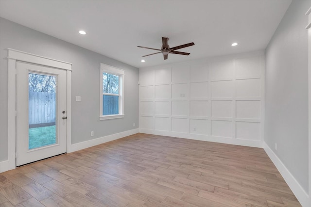 interior space featuring light wood finished floors, baseboards, recessed lighting, and ceiling fan