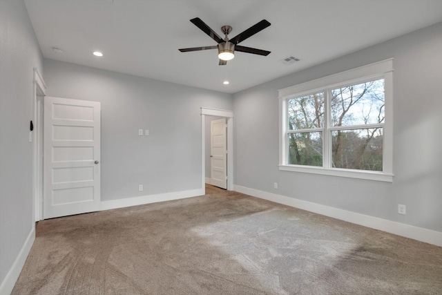 unfurnished bedroom with a ceiling fan, carpet floors, baseboards, visible vents, and recessed lighting
