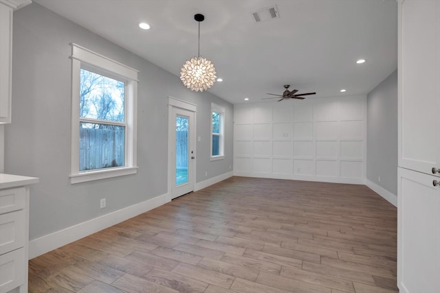 foyer with recessed lighting, light wood finished floors, and baseboards