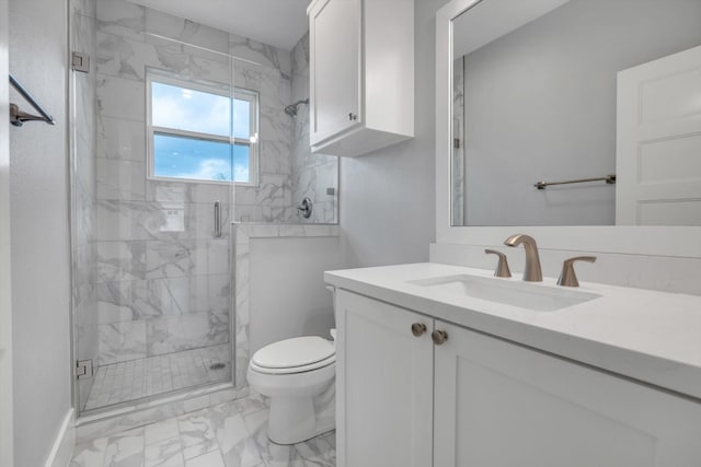 full bath featuring marble finish floor, toilet, vanity, and a stall shower