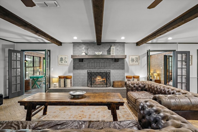 1492 Sleepy Hollow Ln, Canton, TX 75103 - living area featuring visible vents, a ceiling fan, a fireplace, beam ceiling, and brick floor