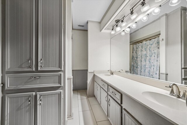 1492 Sleepy Hollow Ln, Canton, TX 75103 - bathroom with tile patterned flooring, double vanity, a sink, and crown molding