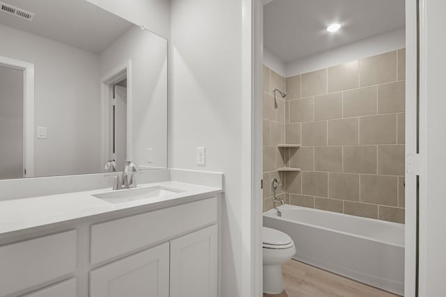 21429 Mary Myrtle St, Spring, TX 77379 - full bathroom with wood finished floors, vanity, and bathing tub / shower combination