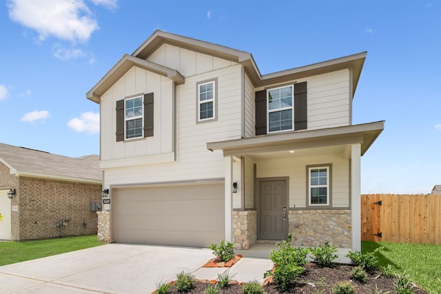 21429 Mary Myrtle St, Spring, TX 77379 - view of front of house featuring board and batten siding, a garage, stone siding, and driveway