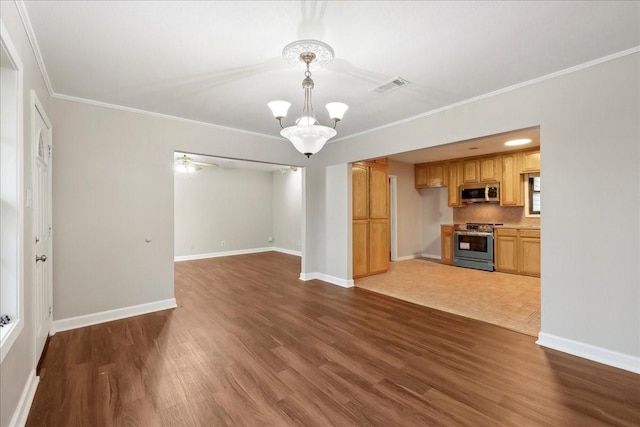 unfurnished living room featuring a chandelier, visible vents, dark wood-type flooring, and ornamental molding