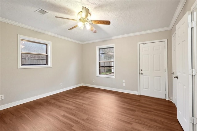 unfurnished bedroom featuring wood finished floors, a textured ceiling, and visible vents
