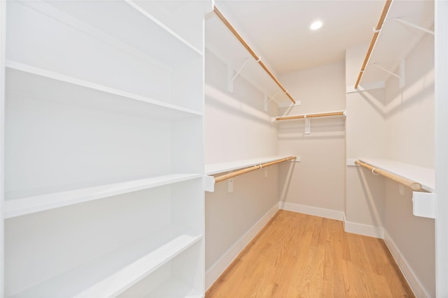 spacious closet featuring light wood-type flooring