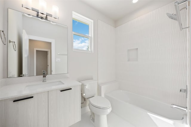 bathroom featuring tub / shower combination, toilet, and vanity