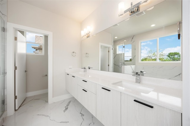 bathroom featuring a sink, a marble finish shower, double vanity, baseboards, and visible vents