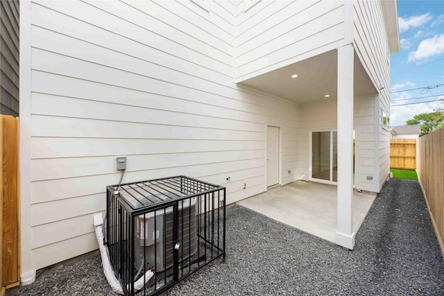 exterior space with fence and a patio area