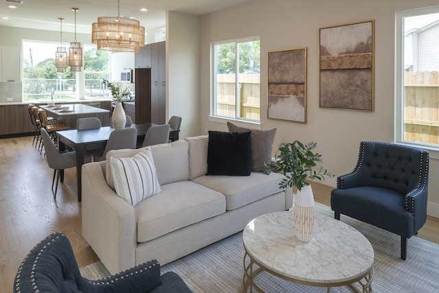 1810 Yates St, Houston, TX 77020 - living area featuring a chandelier, light wood-type flooring, plenty of natural light, and recessed lighting