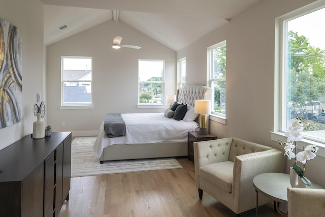 1810 Yates St, Houston, TX 77020 - bedroom with multiple windows, light wood-type flooring, lofted ceiling, and baseboards
