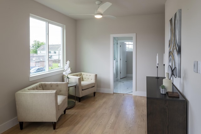 1810 Yates St, Houston, TX 77020 - sitting room featuring ceiling fan, plenty of natural light, baseboards, and light wood finished floors