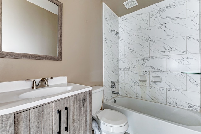 full bathroom with visible vents, toilet, vanity, and bathing tub / shower combination