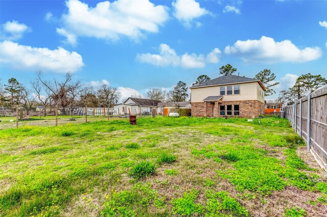 view of yard with a fenced backyard