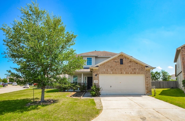 traditional home with concrete driveway, fence, a front yard, and a garage