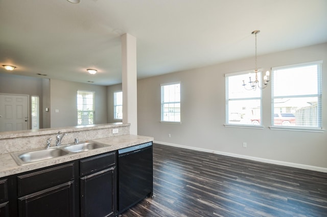 kitchen featuring a sink, dark cabinetry, dark wood-type flooring, baseboards, and black dishwasher