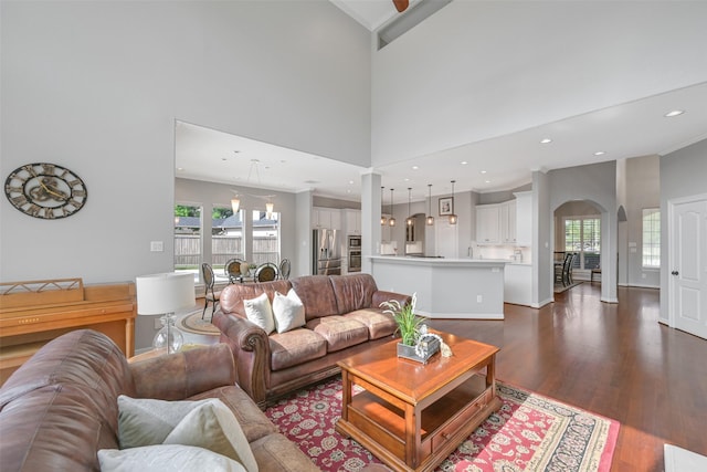 314 Del Monte Dr, Friendswood, TX 77546 - living room with arched walkways, plenty of natural light, dark wood-type flooring, and recessed lighting