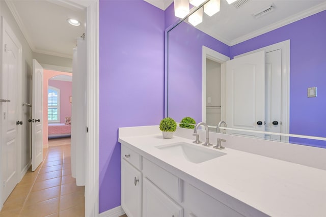 314 Del Monte Dr, Friendswood, TX 77546 - bathroom with vanity, baseboards, ornamental molding, tile patterned flooring, and visible vents