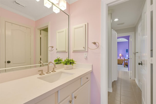 314 Del Monte Dr, Friendswood, TX 77546 - bathroom featuring visible vents, tile patterned flooring, vanity, and ornamental molding