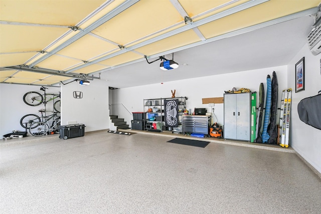 314 Del Monte Dr, Friendswood, TX 77546 - garage with a wall mounted AC and a garage door opener