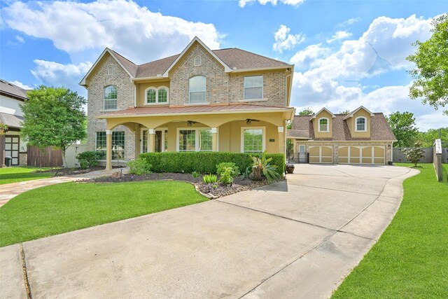 314 Del Monte Dr, Friendswood, TX 77546 - view of front of house with concrete driveway, brick siding, fence, and a front yard