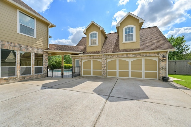 314 Del Monte Dr, Friendswood, TX 77546 - view of front of home with brick siding, fence, driveway, and a shingled roof