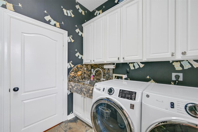 314 Del Monte Dr, Friendswood, TX 77546 - clothes washing area with washing machine and clothes dryer, a sink, and cabinet space