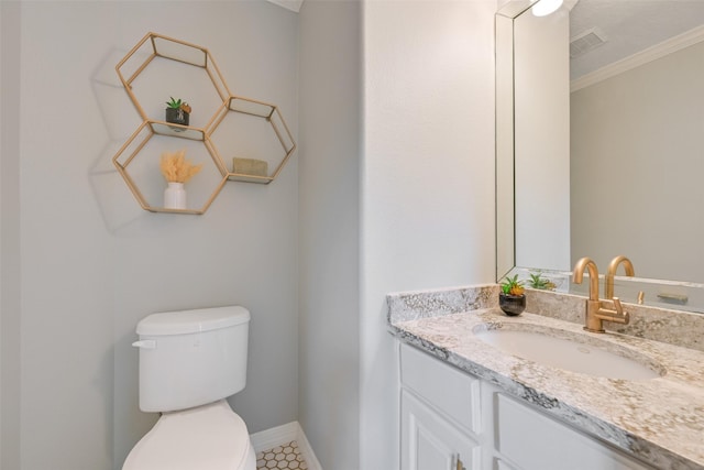 314 Del Monte Dr, Friendswood, TX 77546 - half bathroom featuring visible vents, toilet, vanity, crown molding, and baseboards