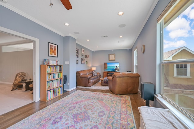314 Del Monte Dr, Friendswood, TX 77546 - living area featuring visible vents, baseboards, recessed lighting, wood finished floors, and crown molding