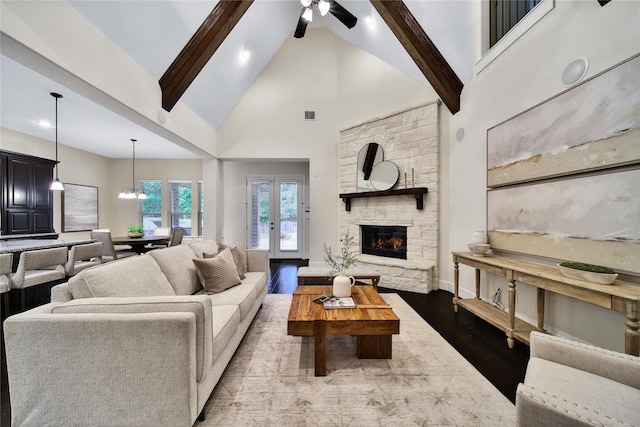 182 River Wilde Dr, Montgomery, TX 77316 - living area featuring high vaulted ceiling, beam ceiling, dark wood-style floors, a fireplace, and ceiling fan
