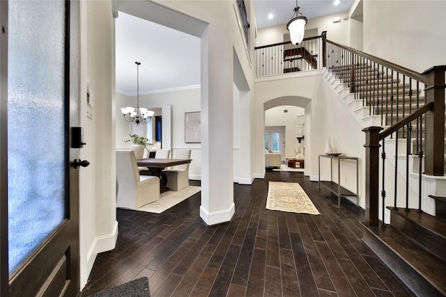 182 River Wilde Dr, Montgomery, TX 77316 - entryway featuring arched walkways, stairs, baseboards, wood finished floors, and ornamental molding